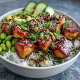 Fork-tender salmon cubes and fluffy jasmine rice create a vibrant Salmon Rice Bowl. 