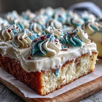 Festive vanilla sheet cake decorated with creamy buttercream and Class of 2026 piping for graduation celebrations.